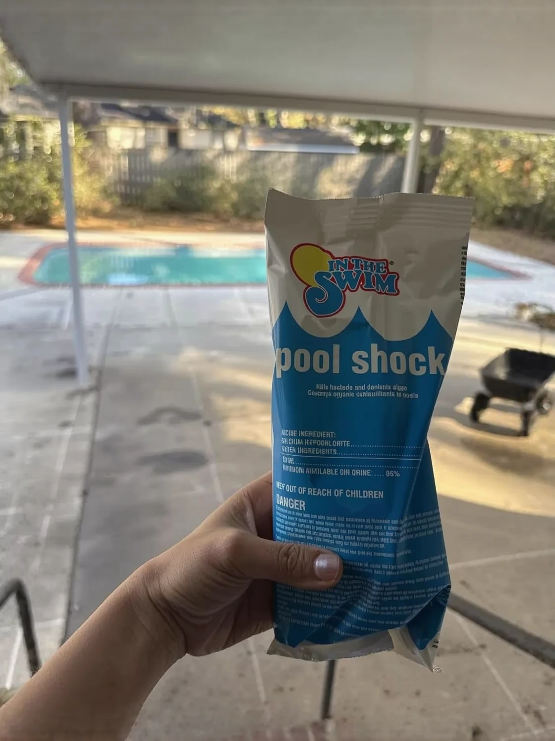 Customer photo of pool opening supplies and chemicals laid out for spring pool maintenance