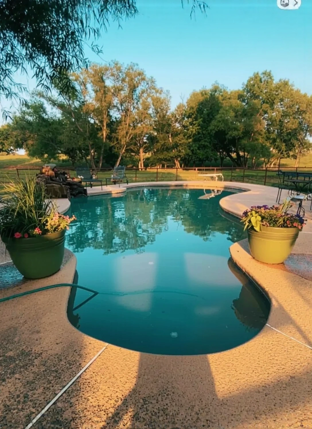 Customer photo of pool opening chemicals and treatment supplies laid out for spring pool startup