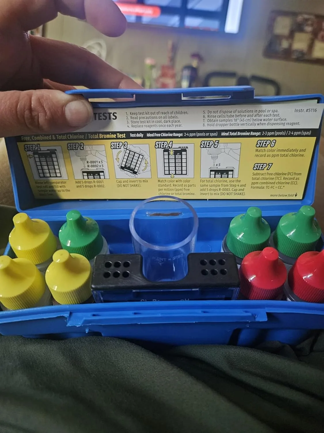 Customer photo of pool test strip color results compared to reference chart