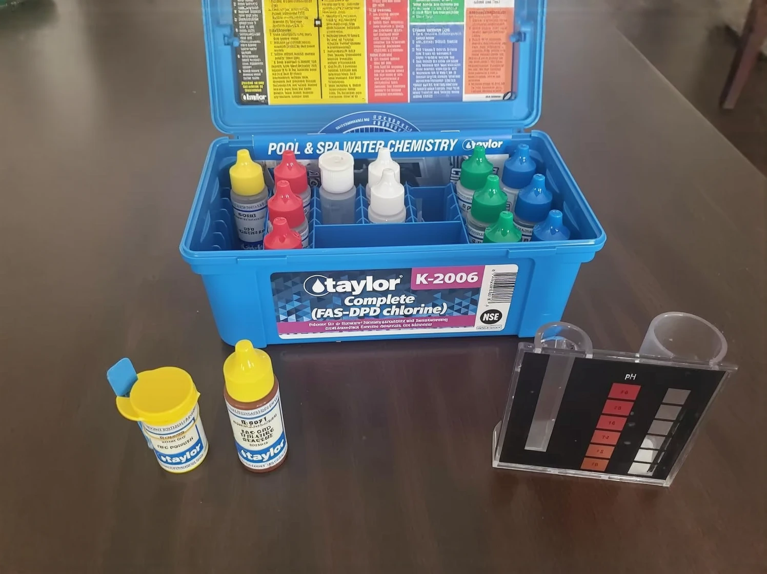 Customer photo of chlorine test kit showing color comparison chart for reading free and total chlorine levels