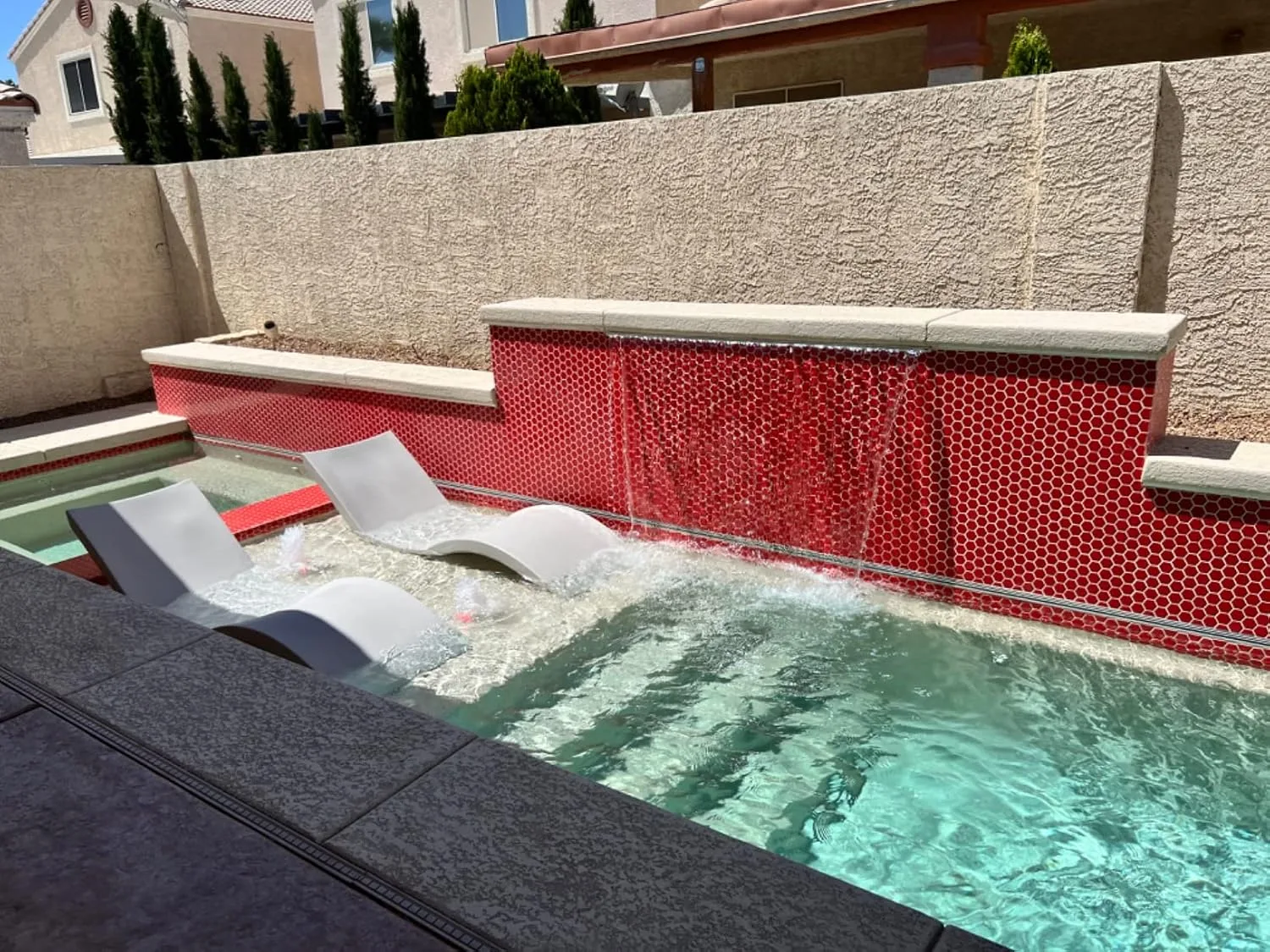 Customer photo of sun shelf installation showing pool deck preparation and mounting
