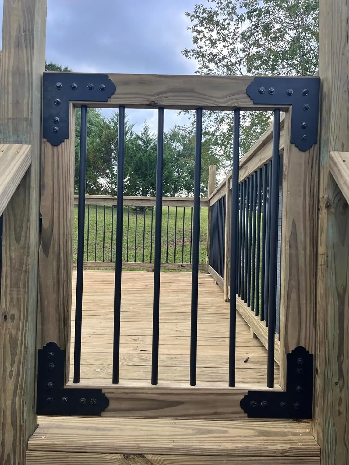 Customer photo of pool baby gate installed at residential pool entrance