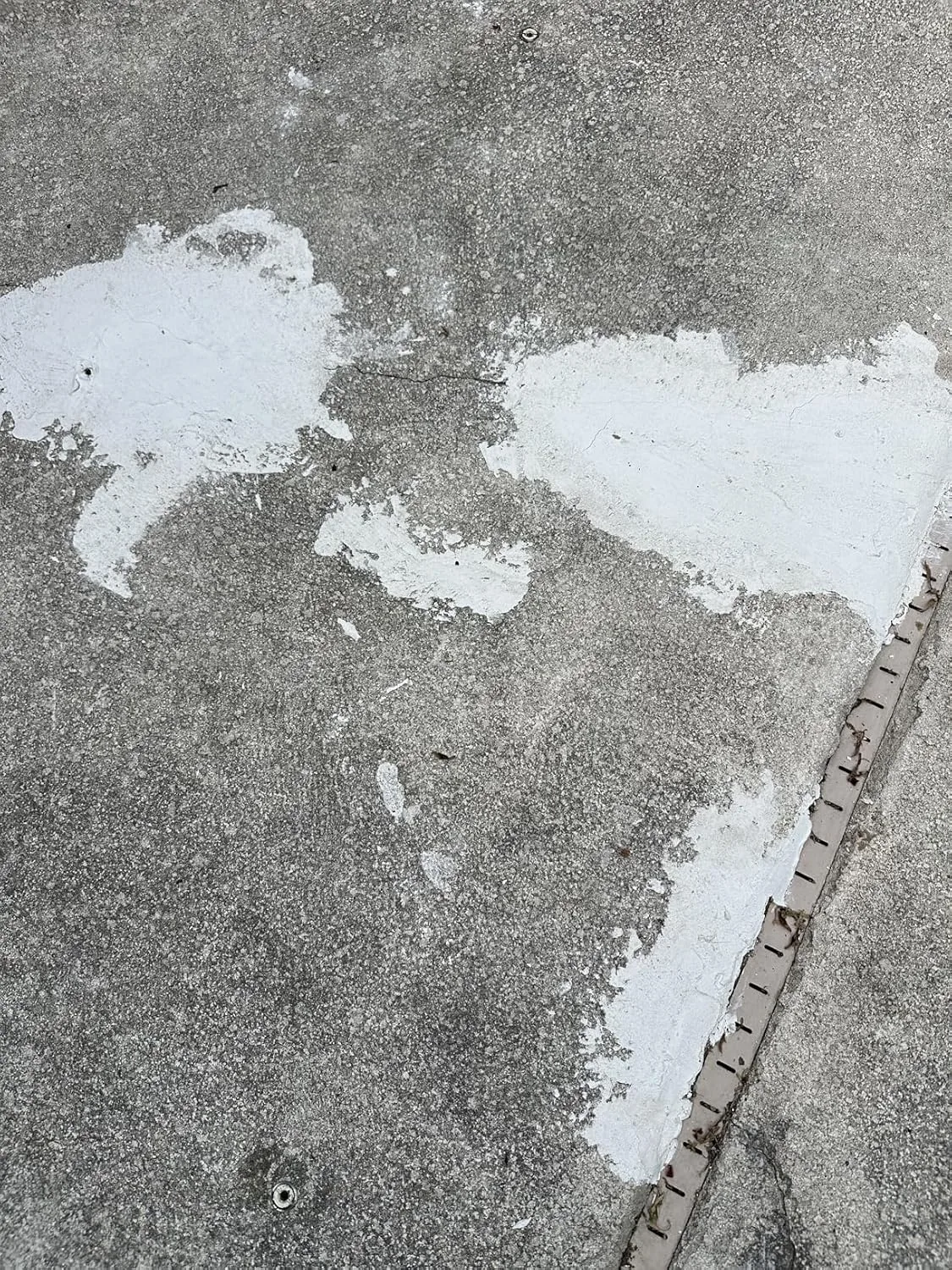 Customer photo of deteriorating pool plaster with visible cracks and rough texture