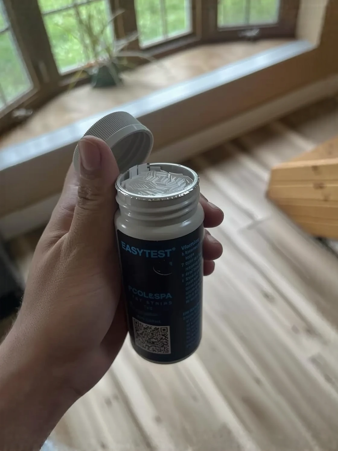 Customer photo of cyanuric acid powder in container with measurement scoop