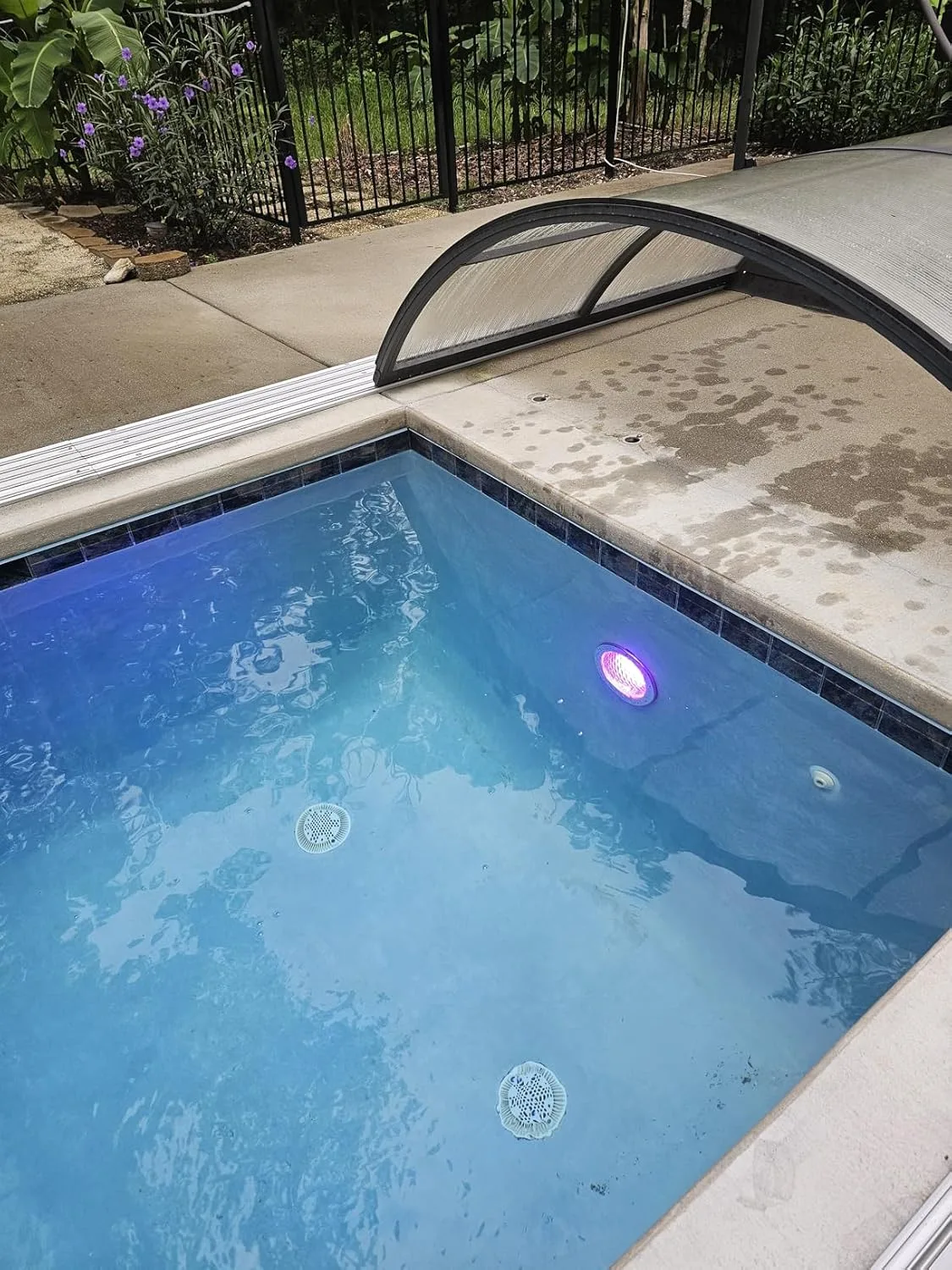Customer photo of underwater LED lights illuminating a swimming pool at night with vibrant blue glow