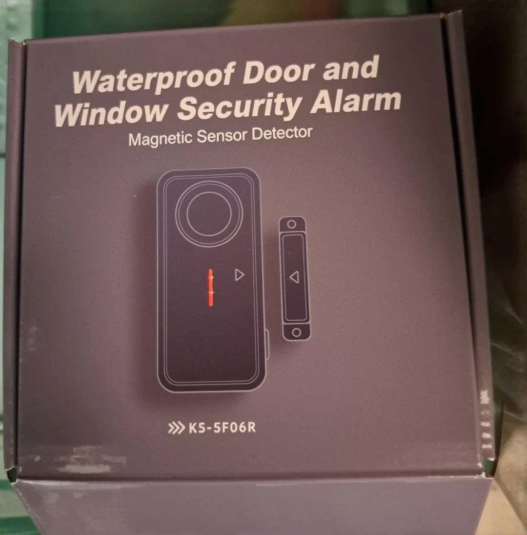 Customer photo of pool alarm and cover system installed together on residential swimming pool