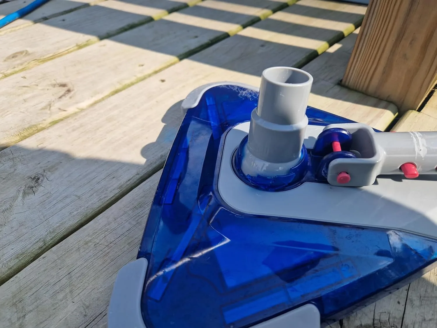Customer photo of vacuum cleaner performance on carpeted floor showing dust and debris collection