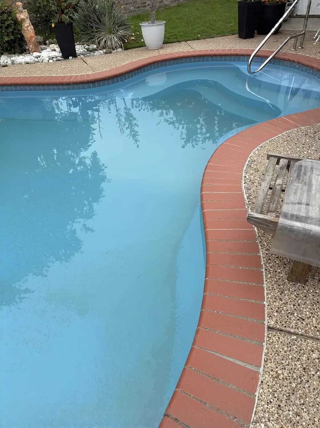Customer photo of cloudy green water in a glass showing water discoloration issue