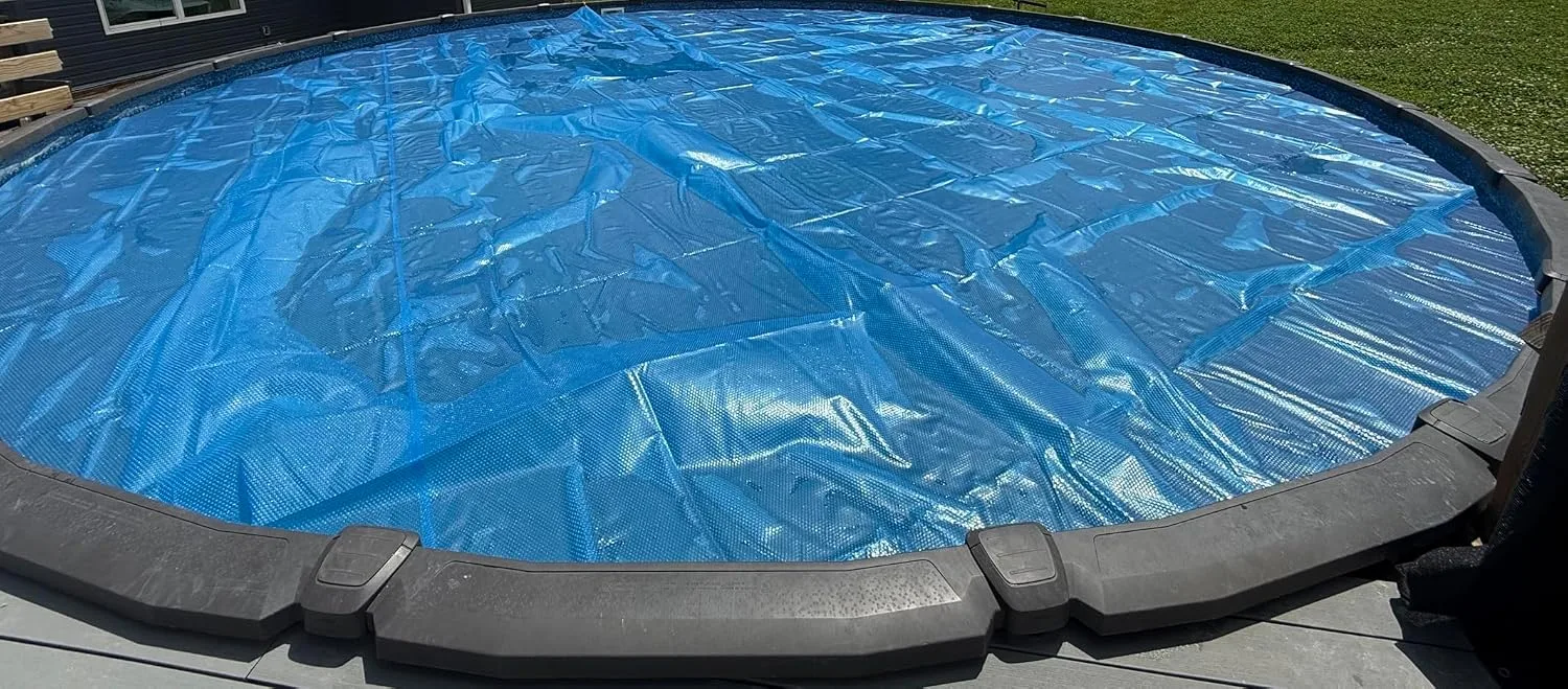 Customer photo of solar blanket covering pool surface during daytime