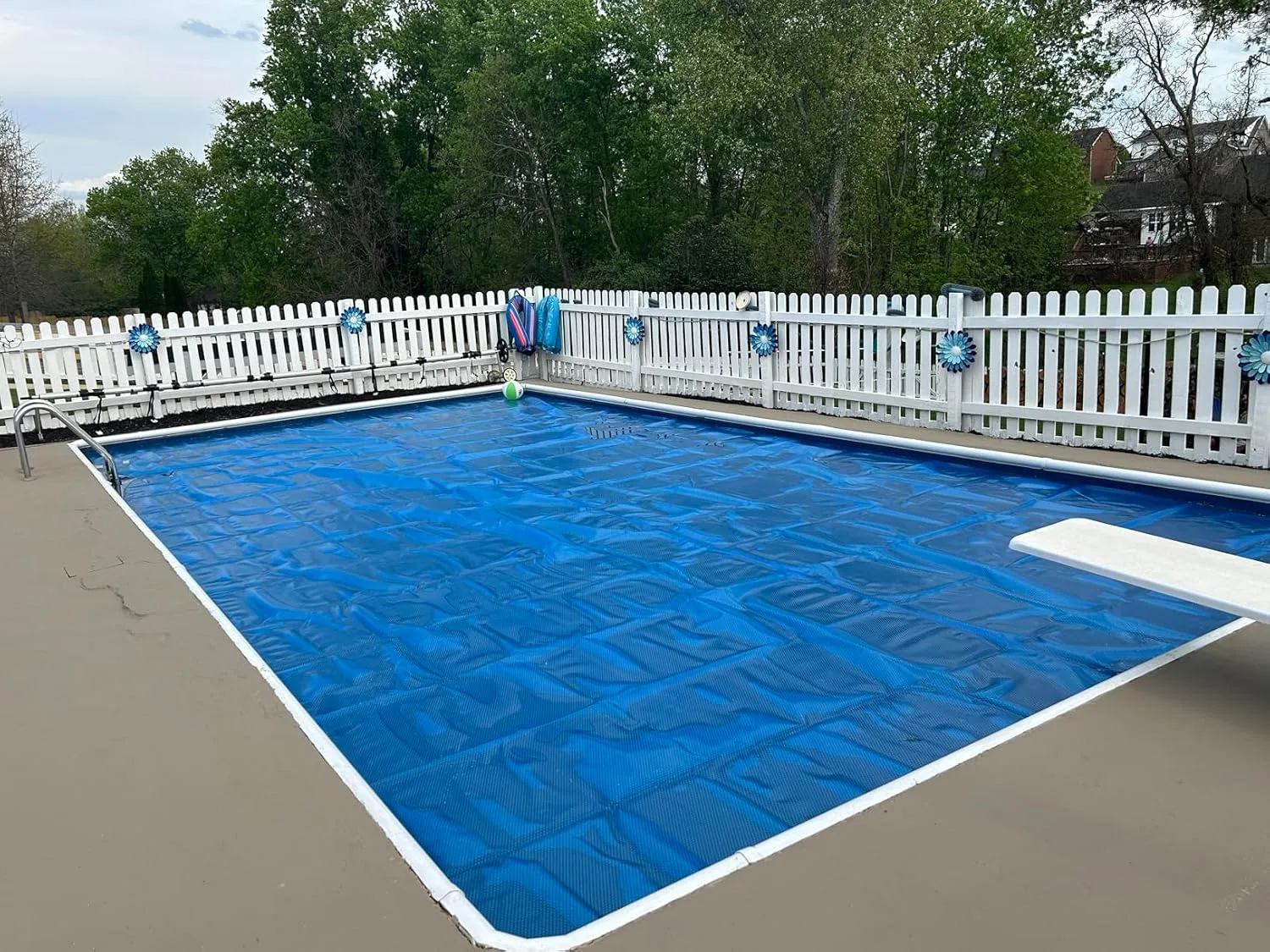 Customer photo of solar blanket covering pool surface during daytime