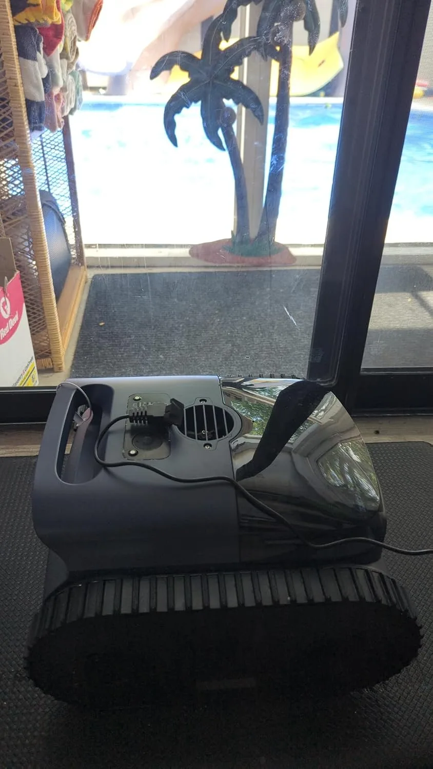 Customer photo of robotic pool cleaner operating on pool floor during cleaning cycle
